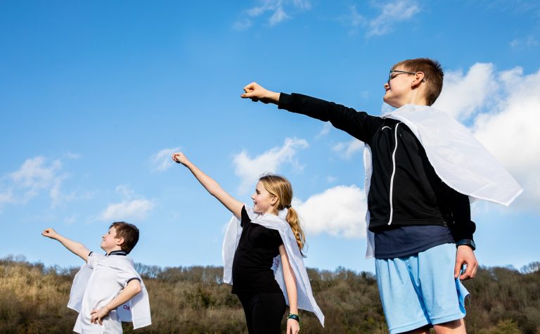 4 children in their superhero poses