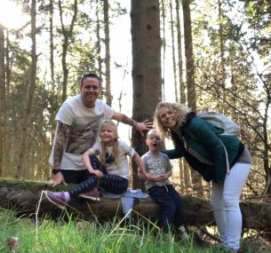 family sitting on tree