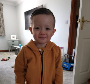 boy in orange hoodie