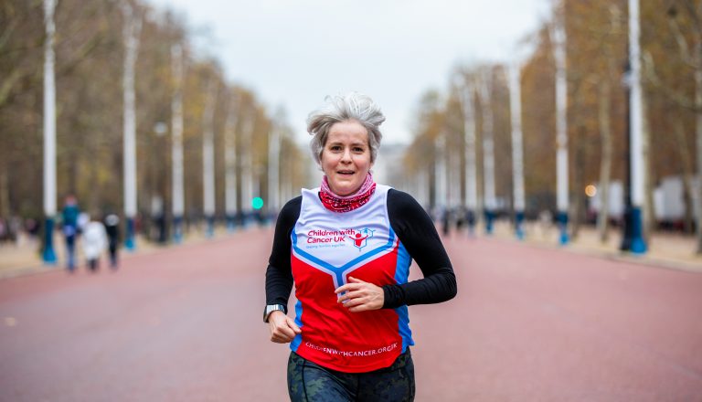 woman running in london marathon for children with cancer uk