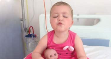 girl in pink dress in hospital