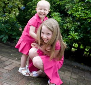 Sisters in pink dresses