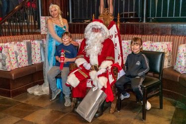 Elsa and children with Santa at the Manchester Christmas party