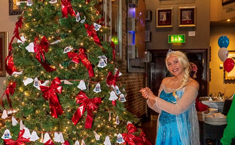 Elsa at the Christmas tree at the Manchester Christmas party