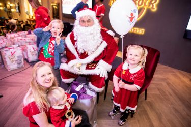 Family with Santa at the London Christmas party