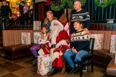 Family with Santa at the Manchester Christmas party