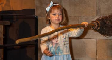 Sophia Bird with broomstick at Warner Bros studio tour