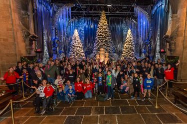 group photo of families at harry porter christmas tour