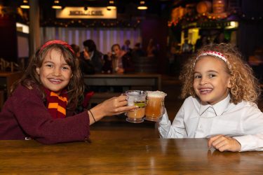 two girls with butterbeer from harry potter
