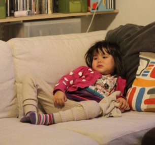 Girl sitting on sofa