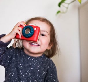 Girl with red camera