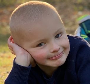 Boy lying on grass