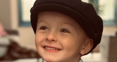 little boy with black beret