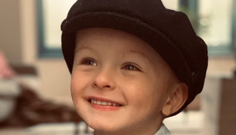 little boy with black beret