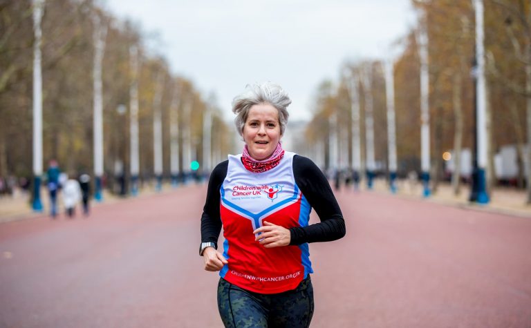 Children with Cancer UK runner, running on her own