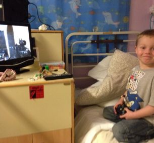 Ollie playing games in hospital