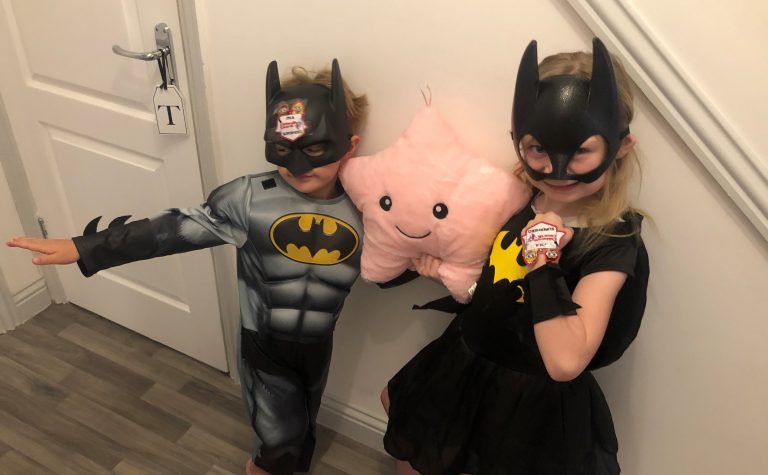 Evie and Tommy dressed as batman and batwoman