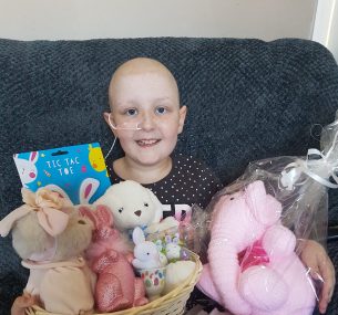 Girl on sofa with gift basket