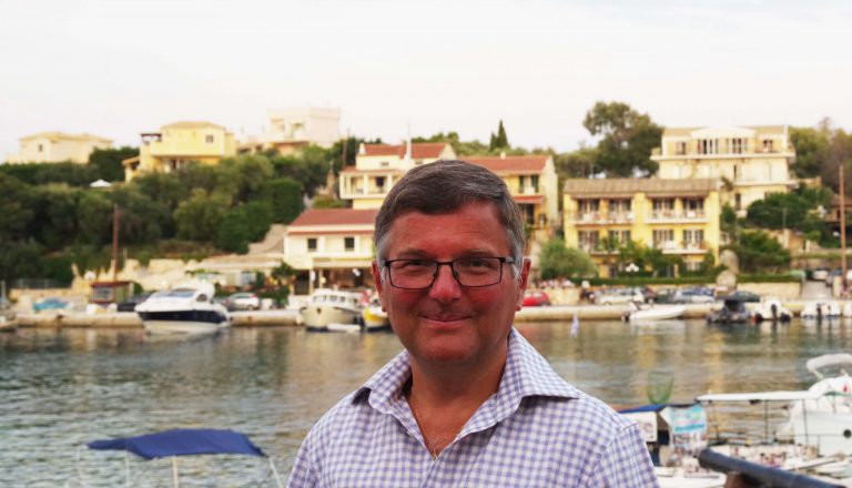 Rod Skinner man looking at camera with the marina behind him