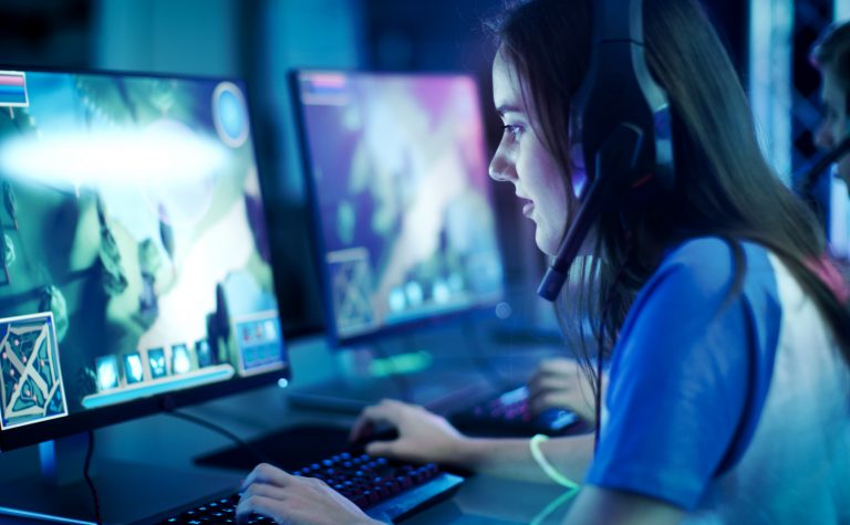 girl sitting playing computer games