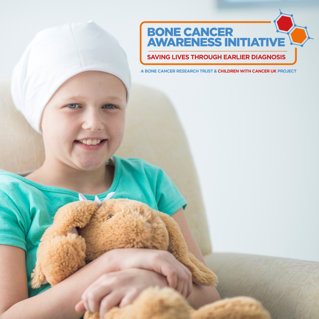 girl smiling holding a teddy for bone cancer awareness initiative