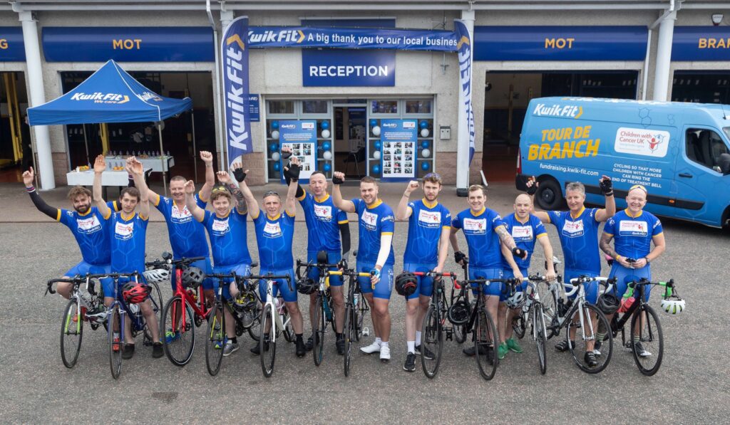 kwik men in a blue on bikes