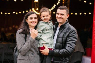 Asian family at zippos smiling at camera