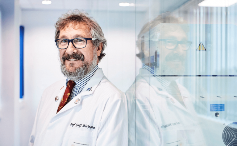 Geoff Pilkington researcher with white lab coat and wearing glasses (1)