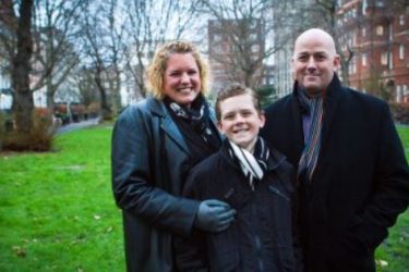 mum dad and son in park