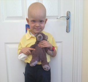 Harry on his First Day Of School in a yellow tshirt holding teddy 1