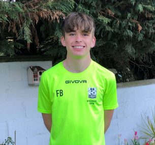 Felix in his lime green football kit 2021.