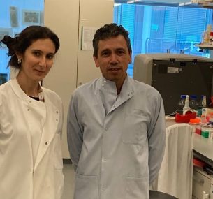 Tariq Enver and Elitza Deltcheva researchers wearing lab coats