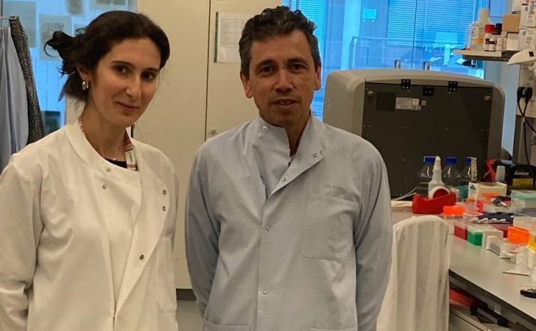 Tariq Enver and Elitza Deltcheva researchers wearing lab coats