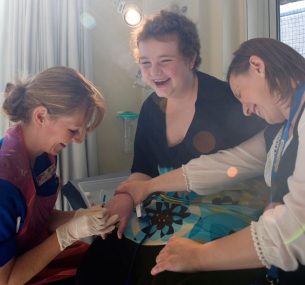 Ellen with two female nurses inserting cannula
