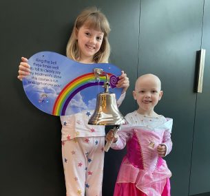 Florie ringing the end of treatment bell