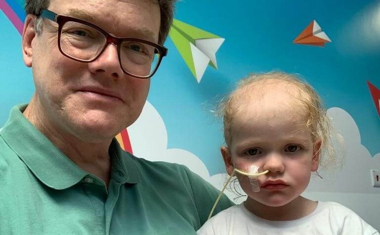Florie with dad James in hospital.