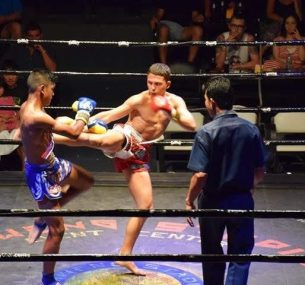 Luciano in the boxing ring kicking in thailand