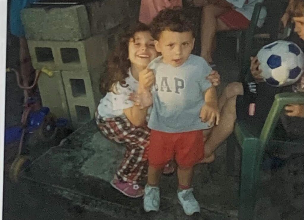 Luciano with his sister as toddlers