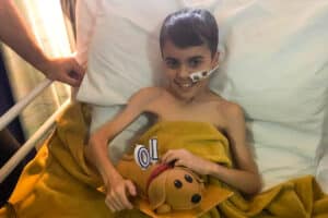 Alfie in hospital bed light