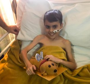 Alfie in hospital bed light
