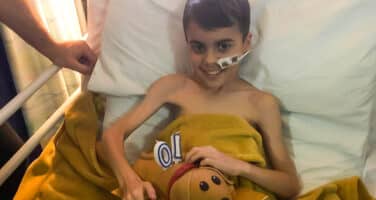 Alfie in hospital bed light