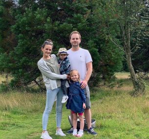 Dax with hat with his mum dad and sister Darcie