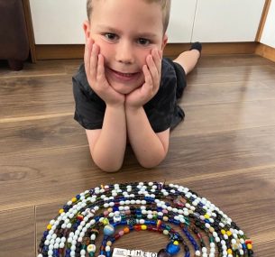 Theo with beads of courage