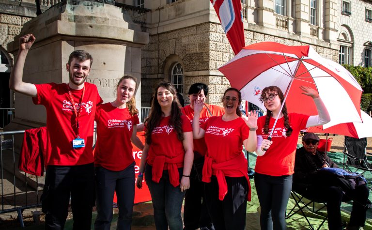 London Marathon staff with red tshirts and umbrella min