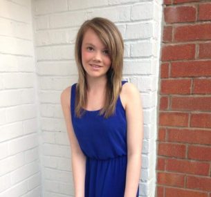 Leah in blue dress before diagnosis