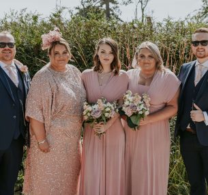 Leah with family at wedding