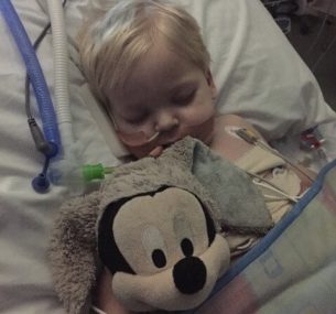 Dylan asleep face on with mickey mouse