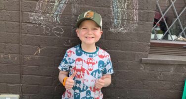 Dylan with beads of courage in nhs letters