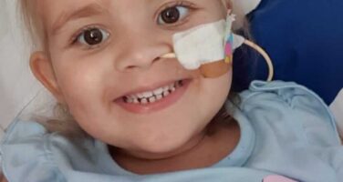 Isabellah with nose tube smiling