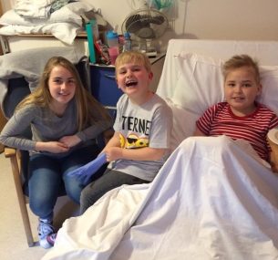 Felix with siblings in hospital smiling Kerry Brown